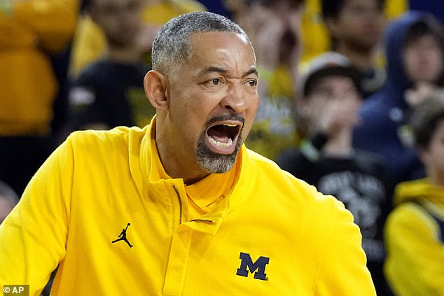 Juwan Howard yells during the first half of an NCAA basketball game against Nebraska