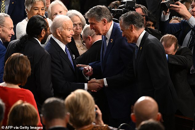 Biden greeted Senators Romney and Manchin as he headed to the podium to deliver his State of the Union address, where he could be heard telling Manchin that Romney has 