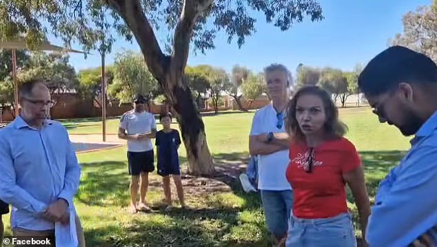 Minister of Early Childhood Education Anne Aly (right) was confronted on Saturday by a gang of pro-Palestinian activists (left)