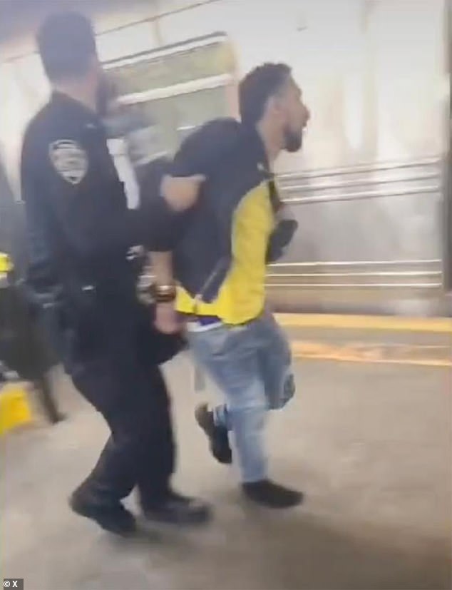 Younece Obuad, 32, (pictured during his arrest), who was suspected of shooting an aggressive subway passenger, will not face charges as Brooklyn prosecutors rule he acted in self-defense