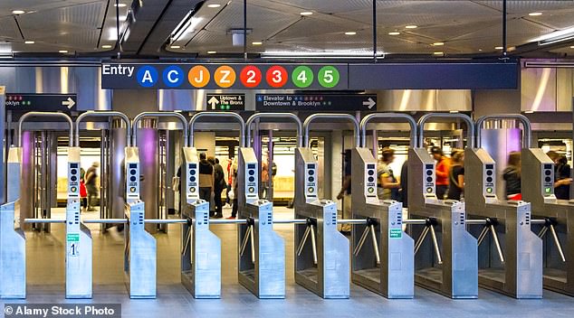 The woman and her partner are said to have had an argument on Saturday morning on the Fulton Street platform in the city's Financial District.