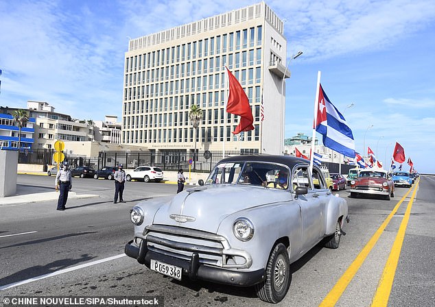 Above, an August 5, 2021 motorcade passes the U.S. Embassy in Havana as part of a protest demanding an end to the six-decade U.S. economic embargo on Cuba