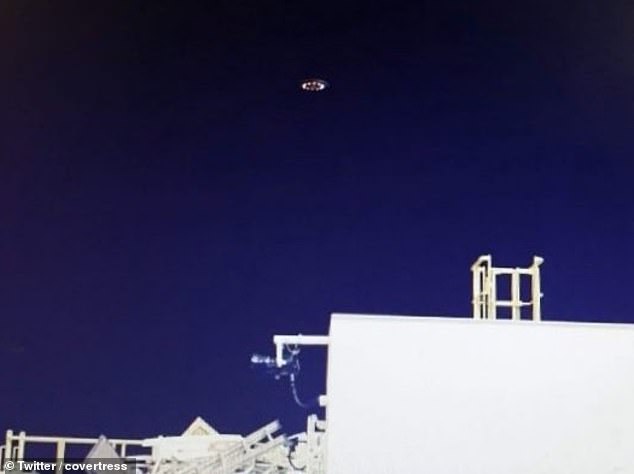 Two UFOs were spotted hovering over an oil rig off the coast of Mexico, where locals believe there is a secret underwater base for aliens.  A crew member from the ship near Tampico captured two images