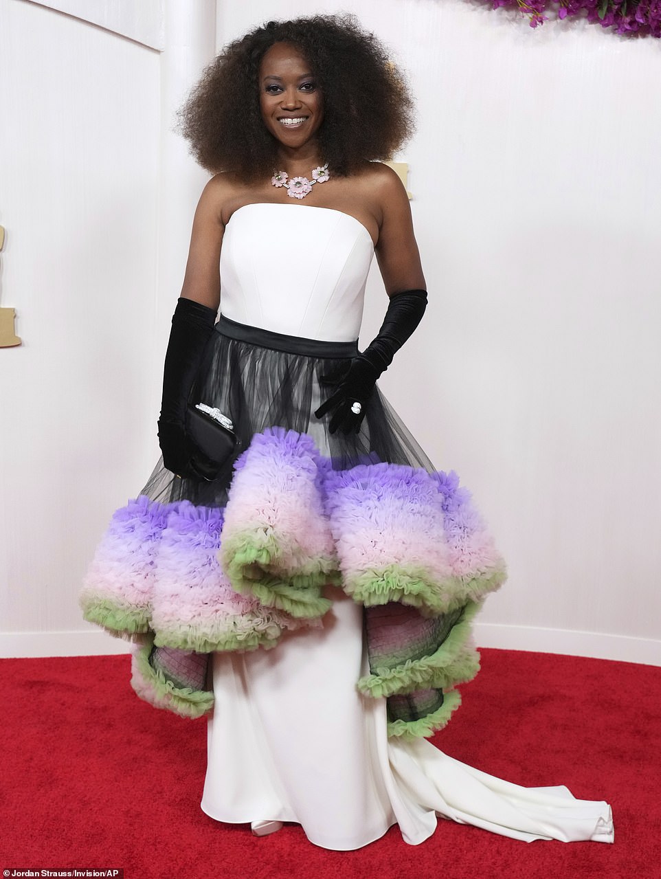 The Cosby Show star Erika Alexander wore what would have been a very elegant white dress - if it weren't for the huge black, purple, pink and green tutu-like skirt that was laced around her waist