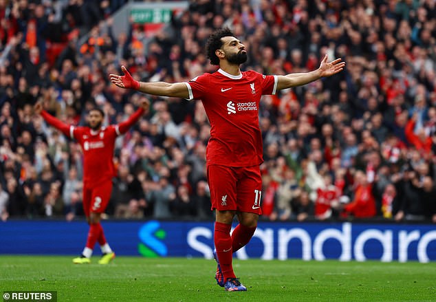 Mo Salah greets the crowd after scoring the goal that sent Liverpool back to the top