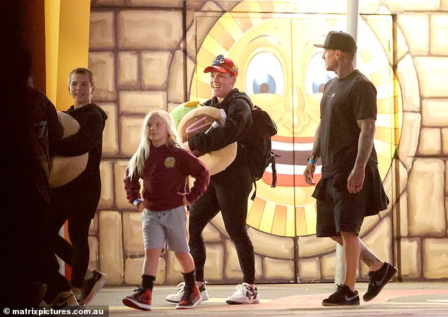 Pink took her family for a night of fun in Sydney during her Summer Carnival tour.  The So What hitmaker was seen with teddies the family had won at a gaming stall.  Pictured with husband Carey Hart (right) and children Willow and Jameson (left)