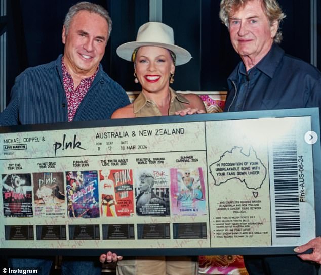 Pink said her tour Down Under broke numerous records and shared a quick photo with her promoter Michael Coppel and manager Roger Davies as they marked her achievements