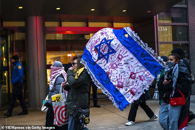 Anti-Israel protesters were seen on video Monday walking past a cancer hospital in New York City, where they shockingly shouted to 