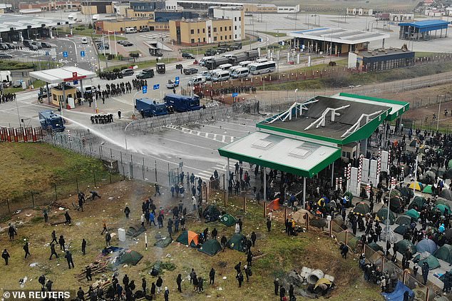 2021: Polish police fire a water cannon at migrants camping on the Belarusian-Polish border near Bruzgi.  Belarus – Russia's close ally – pushed migrants from the Middle East and North Africa towards the borders with Poland, Latvia and Lithuania in 2021