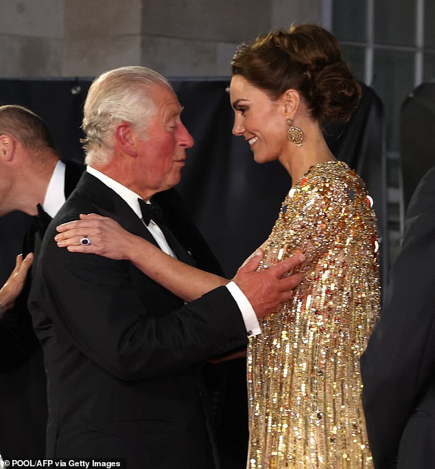 King Charles, pictured here greeting Kate at an event at the Royal Albert Hall in September 2021, said on Friday he was 'so proud' of his 'beloved' daughter-in-law