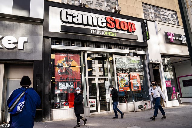 Pedestrians pass a GameStop store on 14th Street in Union Square in Manhattan on January 28.  The GameStop saga is being portrayed by some as a victory of the little guy over Wall Street giants