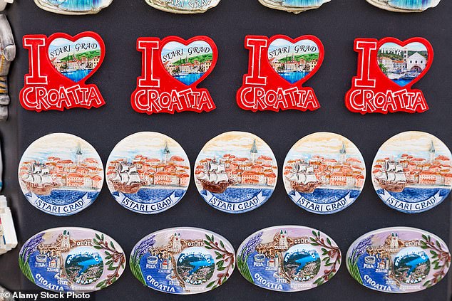 Research has shown that souvenirs such as refrigerator magnets can help protect memories and trigger positive emotional responses, reminding people of happy times