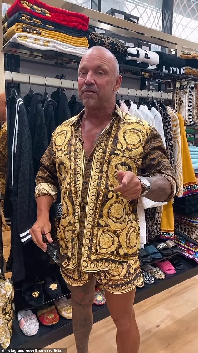 Pictured: Russell Manser in a designer clothing store in Melbourne