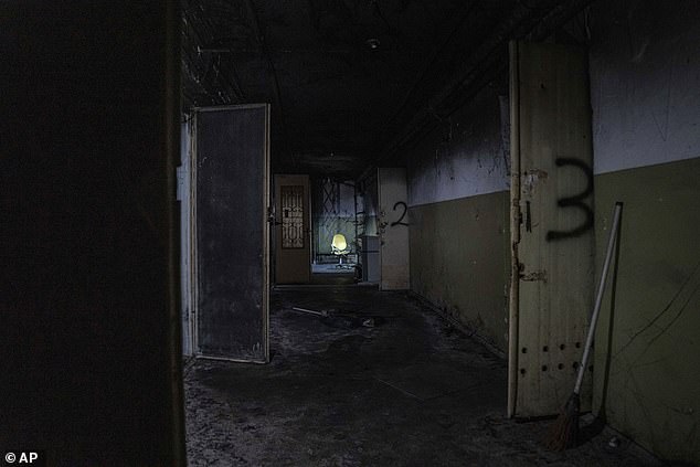 An office chair stands in the hallway of a basement of a building that a war crimes prosecutor says is being used by Russian forces as a torture site in Kherson, Ukraine, Thursday, December 8, 2022