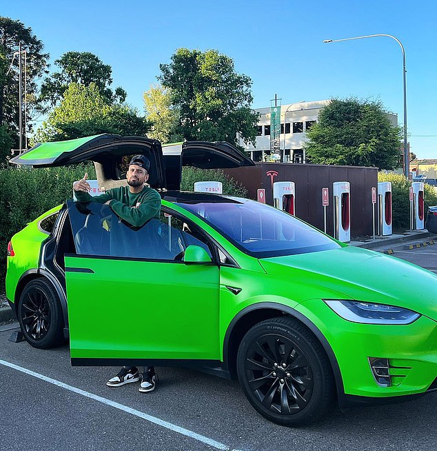 Tennis star Nick Kyrgios, 28, with his lime green Tesla (pictured) that was stolen in May last year.  Kyrgios helped police track the car using the Tesla app, which also limited the car's speed