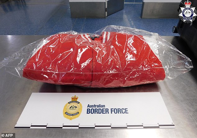 Officers searched the woman's bag and cut open the lining of several jackets (pictured), where they found small parcels hidden in the seams