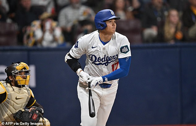 Los Angeles Dodgers' Shohei Ohtani gets a hit in the first inning on Thursday in Seoul