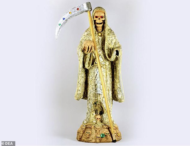 Seized by the DEA in 2011 from two women transporting more than 700 grams of methamphetamine between Arizona and Minnesota, this statue of the Holy Death was painted gold to represent economic power, success and prosperity