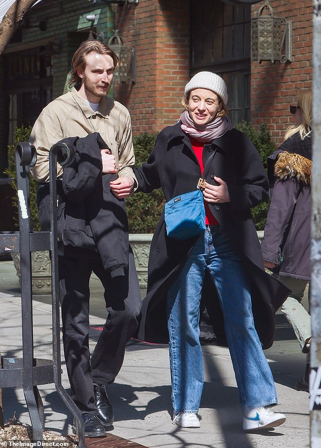 Stella Baker (right) looked just like her dad as she took a winter walk in New York City on Sunday