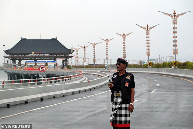 Traditional security personnel known as pecalang patrol the streets of Nyepi