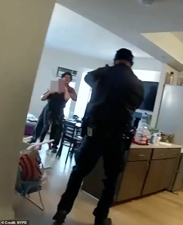 Officer Alex Morgese is seen on his partner's bodycam holding a gun to Michael Dotel, 30, as he puts his mother in a chokehold