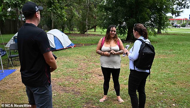 Mr MccGill said even though people living in the park are homeless, it doesn't mean they haven't tried to get back on their feet (photo of woman speaking to Queensland Housing Department staff)