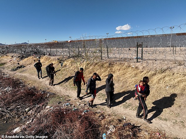 Migrants arrive in the Rio Grande in El Paso, Texas, on March 4.  The Lone Star State is temporarily banned from enacting a new law that allows law enforcement officials to arrest suspected illegal immigrants