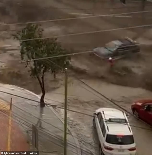 Heavy rainfall caused reservoirs to flood La Paz, Bolivia, on Wednesday.  In one incident, a man was crossing the street when water poured over the wall of a reservoir, knocking him to the ground