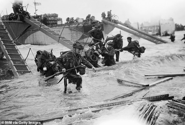 Royal Marines storm the beaches in June 1944. Forty years later, in June 1984, Garcia visits Normandy on what must have been an emotional journey.  He died in 1988