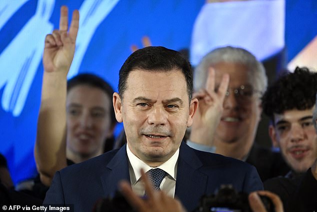 Democratic Alliance (AD) leader Luis Montenegro addresses his supporters at the party's headquarters last night during election night in Lisbon