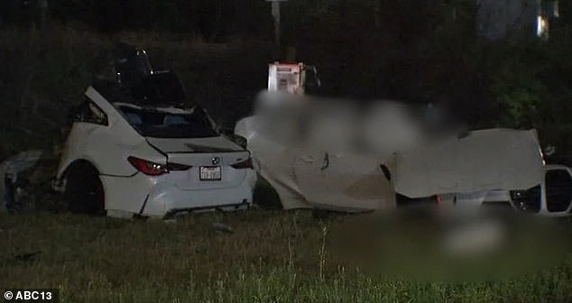 It is understood the duo died after their BMW crashed into another vehicle while traveling at a speed of more than 100 miles per hour.  Police said the crash left the car (seen) 'split in two'