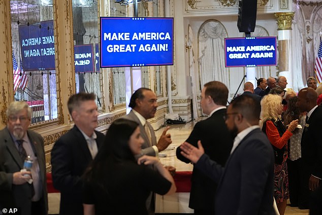 Guests wait before Donald Trump speaks at a Super Tuesday election party at Mar-a-Lago