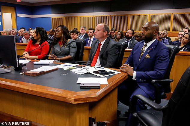 Fulton County's embattled district attorney stunned the hearing by sitting behind the prosecutor's table, just a few chairs away from her former lover