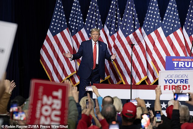 Republican candidate Donald Trump greets fans at a rally in Rome, Georgia, on Saturday