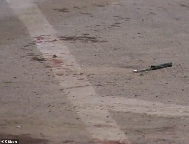 In the aftermath, a knife was pictured in a cordoned off area of ​​the blood-stained street