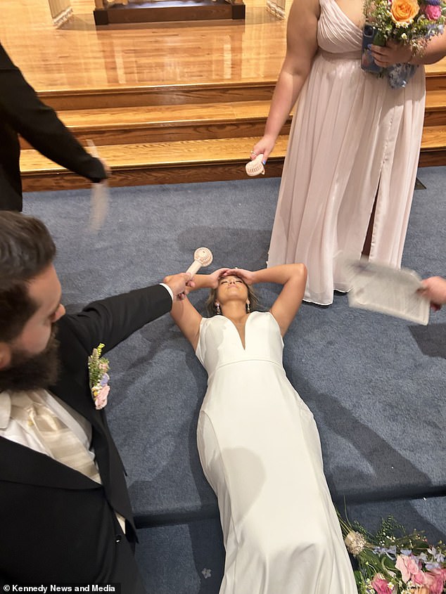 Catherine Frnaks, 28, fainted on her own wedding day after enduring 37-degree heat at the altar under the lamps where she said, 'I do'