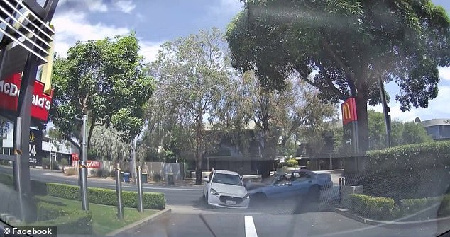 Shocking dashcam footage captured the moment a speeding Toyota Camry crashed into a Mazda sedan near a McDonald's drive-through in Adelaide on Wednesday