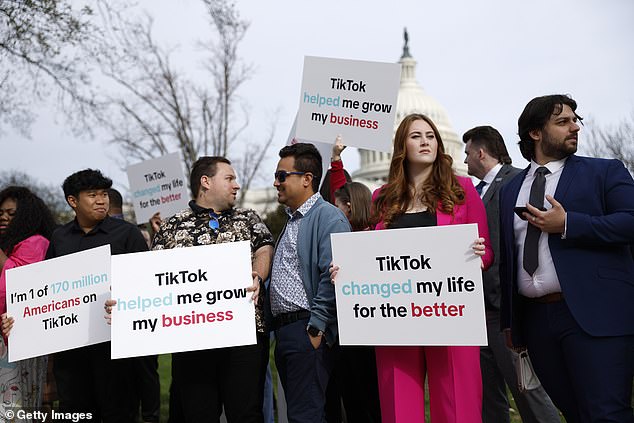 TikTok today faces the prospect of a US ban amid fears its Chinese owner poses a threat to national security.  Pictured: Protesters holding signs of support outside the U.S. Capitol