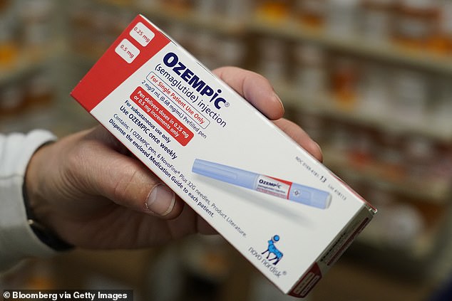 A pharmacist arranges a box of Novo Nordisk A/S Ozempic brand semaglutide medications at a pharmacy in Provo, Utah, USA, on Monday, November 27, 2023