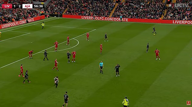 A young supporter stormed onto the pitch during the match between the Liverpool legends and Ajax