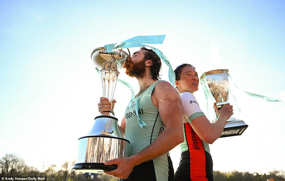 The victorious men and women of Cambridge posed with their respective trophies after climbing out of their boats