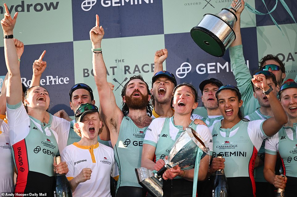 The male and female crew members gathered on stage to celebrate with their trophies and bottles of champagne