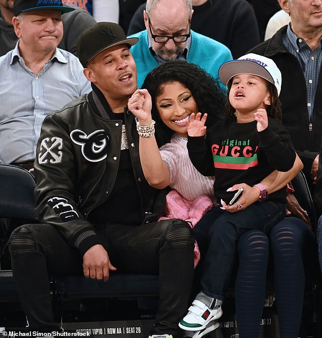 The 41-year-old rap artist - who recently suffered a wardrobe malfunction on stage - was joined by husband Kenneth Petty and their three-year-old son 'Papa Bear'