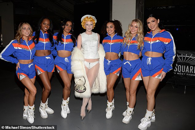 Fox posed next to the Knicks City Dancers, who coordinated in cropped track jackets and shorts