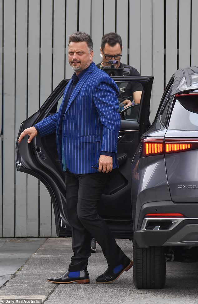 Timothy looked chic in a blue pinstripe jacket and black trousers.  Pictured