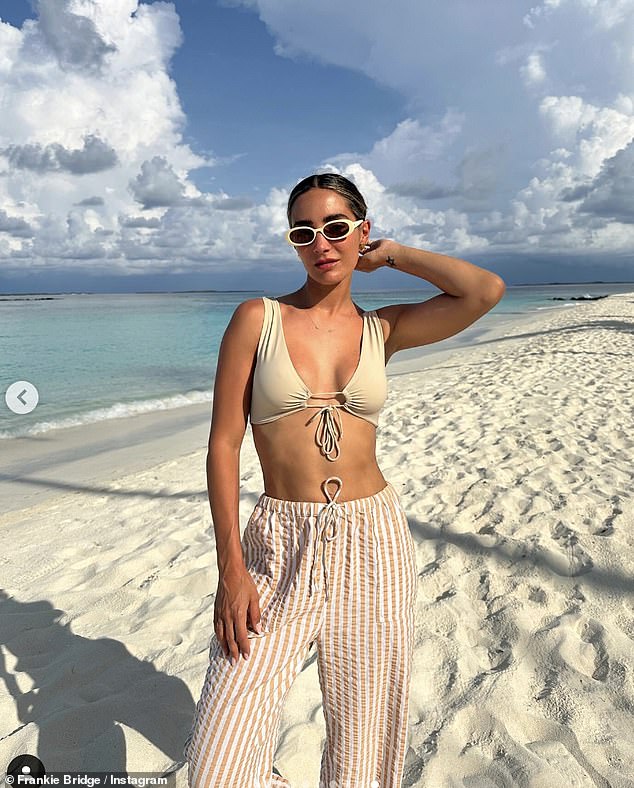 The singer also pulled off another stylish look as she wore a beige Riotswim tie-front bikini top.  with Topshop beach pants