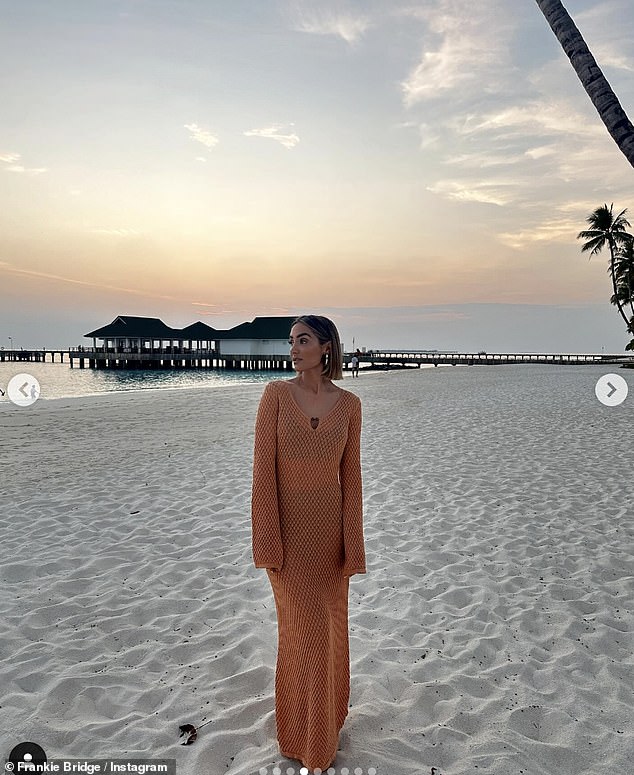 Another of her incredible looks was an embroidered orange semi-sheer beach dress from Pretty Lavish, paired with chunky earrings as the star posed in front of the sunset.