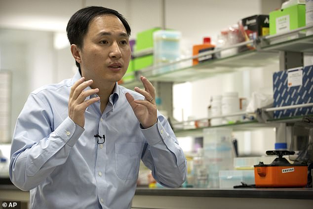 Dr.  He (pictured in his lab in 2018) says he is proud of his research and that society will 'eventually accept' human genome editing