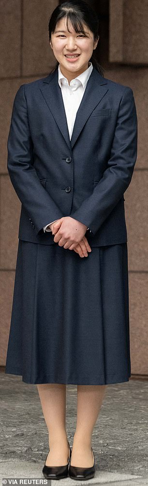 She chose to wear a smart navy blue skirt suit for her first day