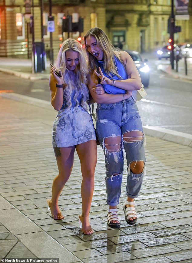 Two friends pose for the cameras as they visit Newcastle for a night out on Easter Sunday